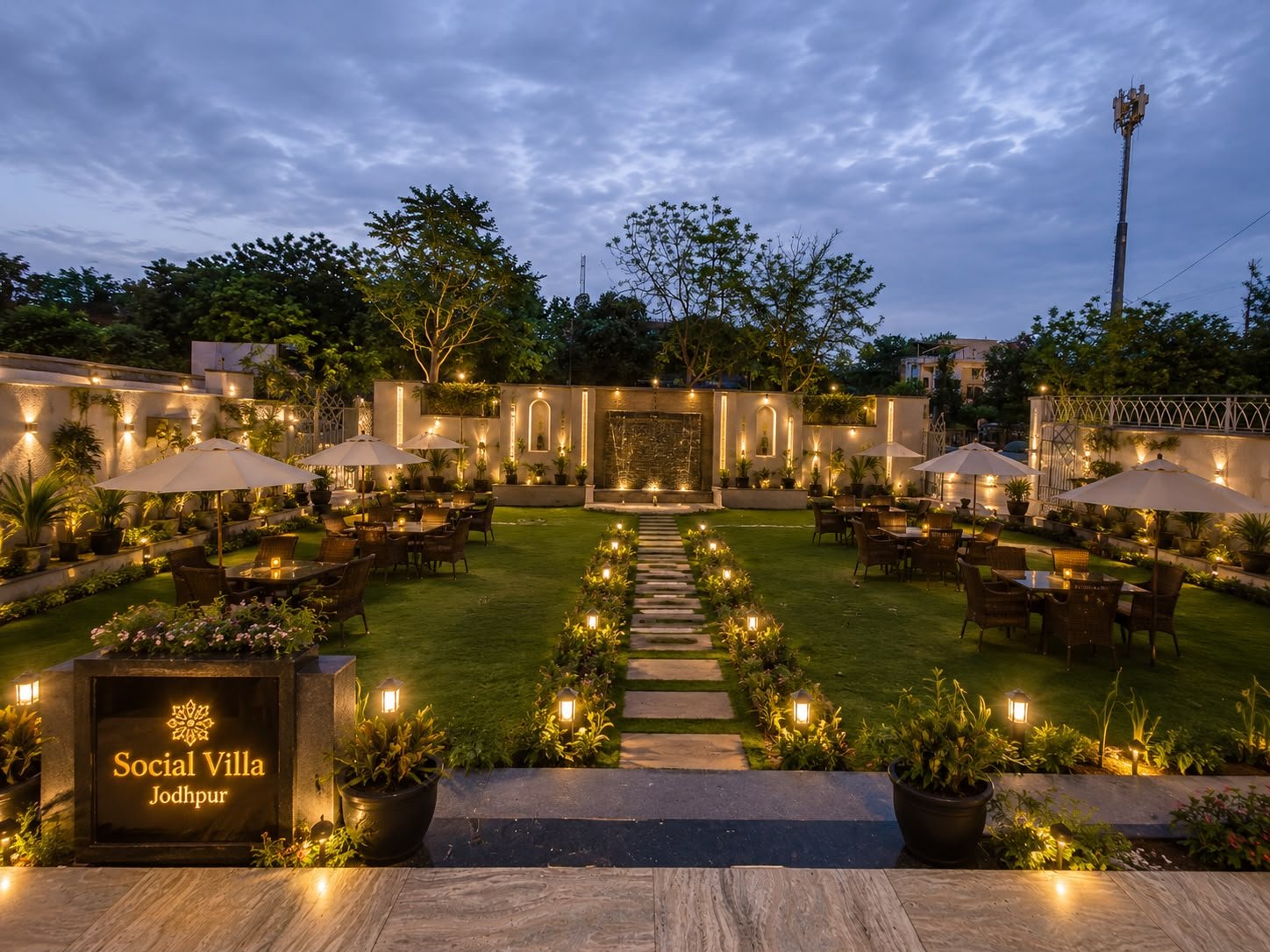 Lantern-lit garden lawn and water feature at Social Villa Jodhpur
